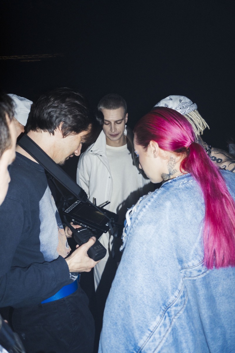 Izaak reviewing a shot with the team on the set of CROWD